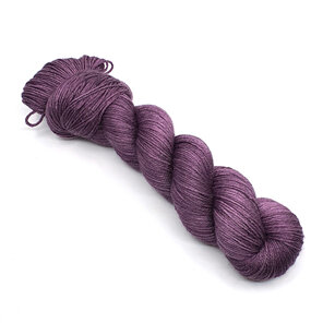 skein of 4ply merino/silk yarn in aubergine purple