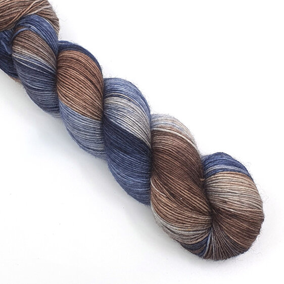 skein of Bluefaced Leicester wool in steel blue, light grey and brown