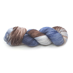 skein of merino/nylon yarn in a variegated light grey, steel blue and brown