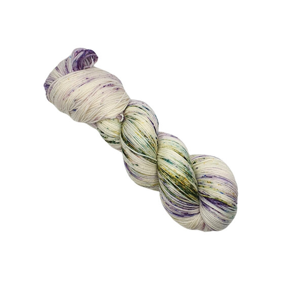 skein of yarn in natural cream, lilac, green with hints of blue and pink