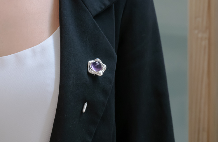 Suffrage 125 silver & amethyst pin by The Village Goldsmith & Te Puna Foundation