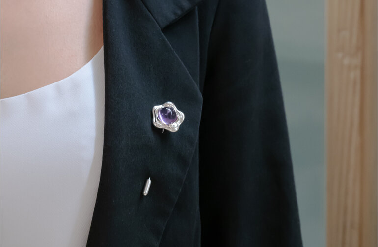 Suffrage 125 silver & amethyst pin by The Village Goldsmith & Te Puna Foundation