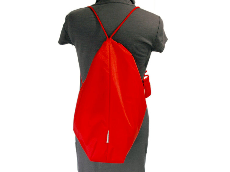 swim pouch red worn as back pack