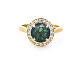 Teal Sapphire and Diamond Halo Ring in yellow gold