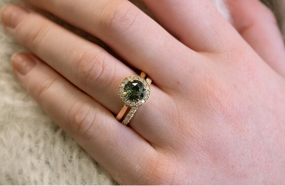 Teal Sapphire and Diamond Halo Ring in yellow gold
