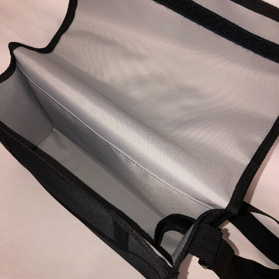 The inside of the bag is lined in silver so you can easily find things inside