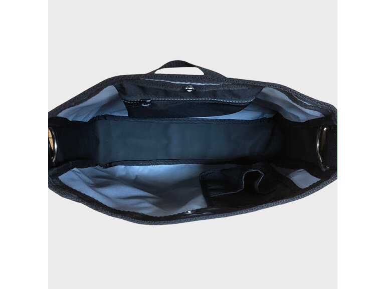 The interior of this carryall consists of a phone pocket and zip pocket