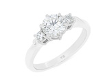 Three stone diamond engagement ring with koru detail in band 18ct gold platinum