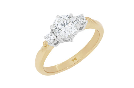 Three stone diamond engagement ring with koru detailing in band 18ct gold