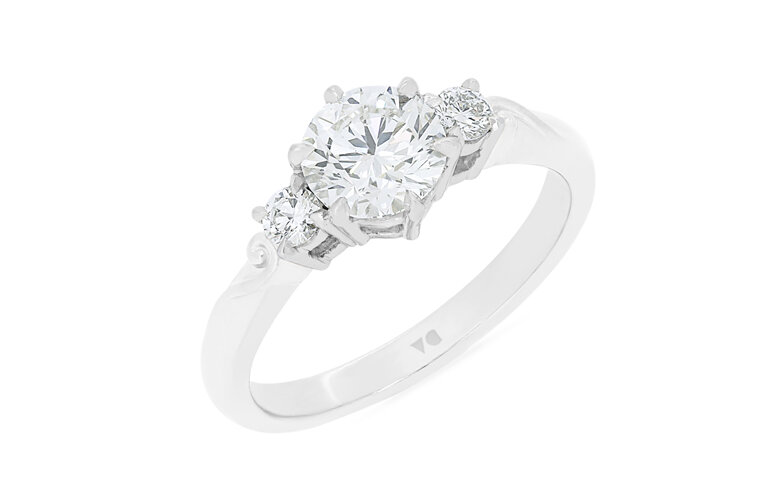 Three stone diamond engagement ring with koru detail in band 18ct gold platinum