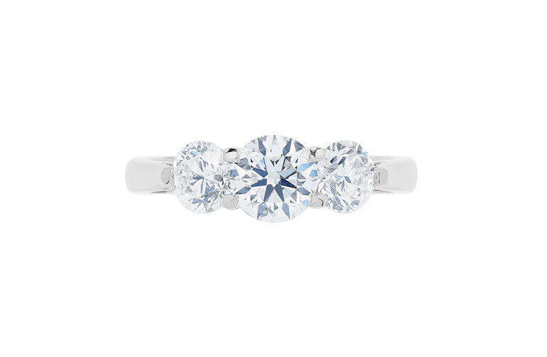Three stone round brilliant cut diamond engagement ring platinum lotus setting