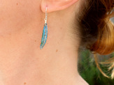 tui feather blue green irridescent long earrings dangle bird nature