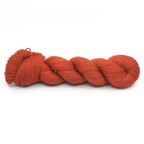 twisted skein of 4ply Bluefaced Leicester in paprika / red ochre tones