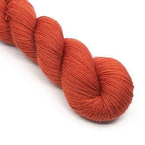 twisted skein of 4ply Bluefaced Leicester in paprika / red ochre tones