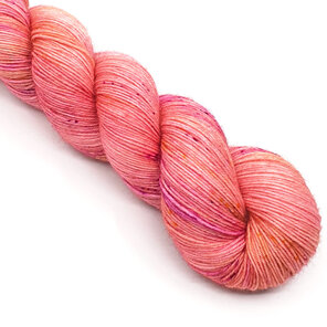twisted skein of 4ply Bluefaced Leicester in peachy pink with speckles