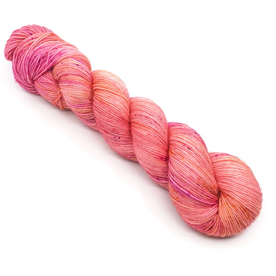 twisted skein of 4ply Bluefaced Leicester in  peachy pink with speckles