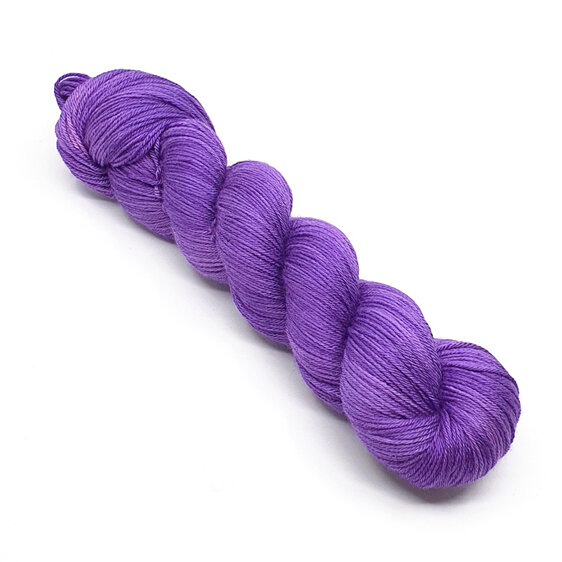 twisted skein of 4ply merino silk yarn in purple hues