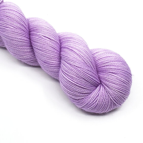 twisted skein of 4ply yarn in semi solid light lilac hues
