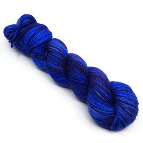 twisted skein of DK merino in a variegated sapphire blue and lilac