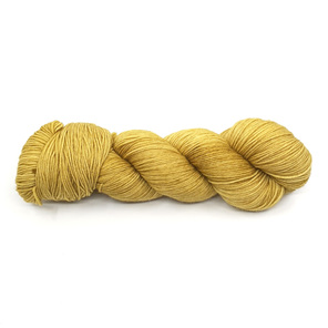 twisted skein of yarn in a semi solid ginger colourway