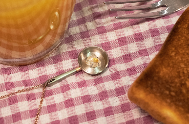 Unique rough diamond frying pan fried egg pendant with toast, orange juice, fork
