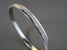 Vapour hand engraved sterling silver bangle