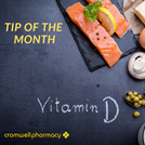 Vitamin D written on a black chalkboard along with salmon, lemon and parsley.