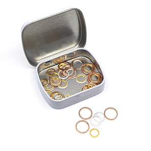 white tin of closed stitch markers in rose gold, silver and gold