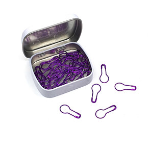 White tin with lid open and purple light bulb stitch markers inside and out