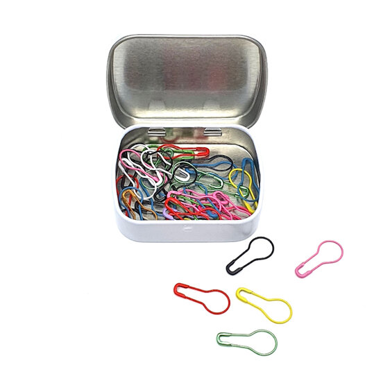 white tin with lid open with multi coloured light bulb stitch markers inside