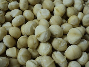 Whole natural macadamia nuts, dried, cracked and packed in 100g foil bags
